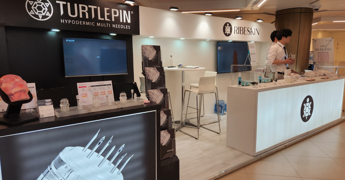 TURTLEPIN and RIBESKIN with skincare products at display at the AMWC 2024 booth in Monaco